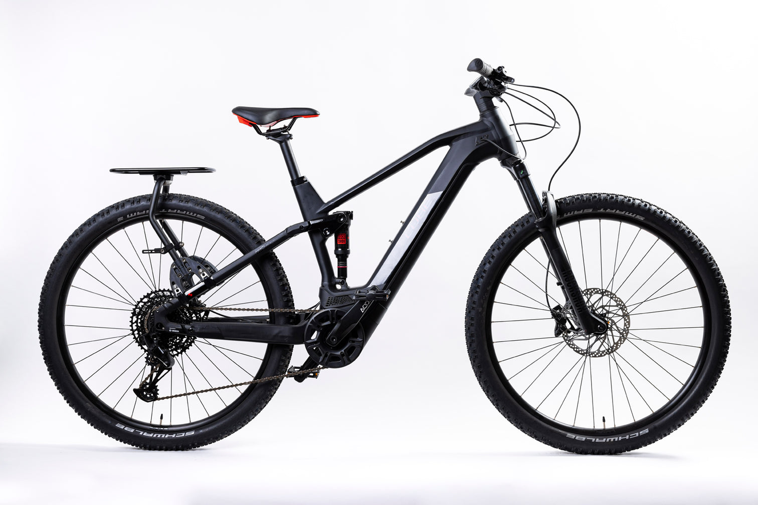 A picture of the Aeroe Pannier Rack attached to the back of a dual suspension mountain bike