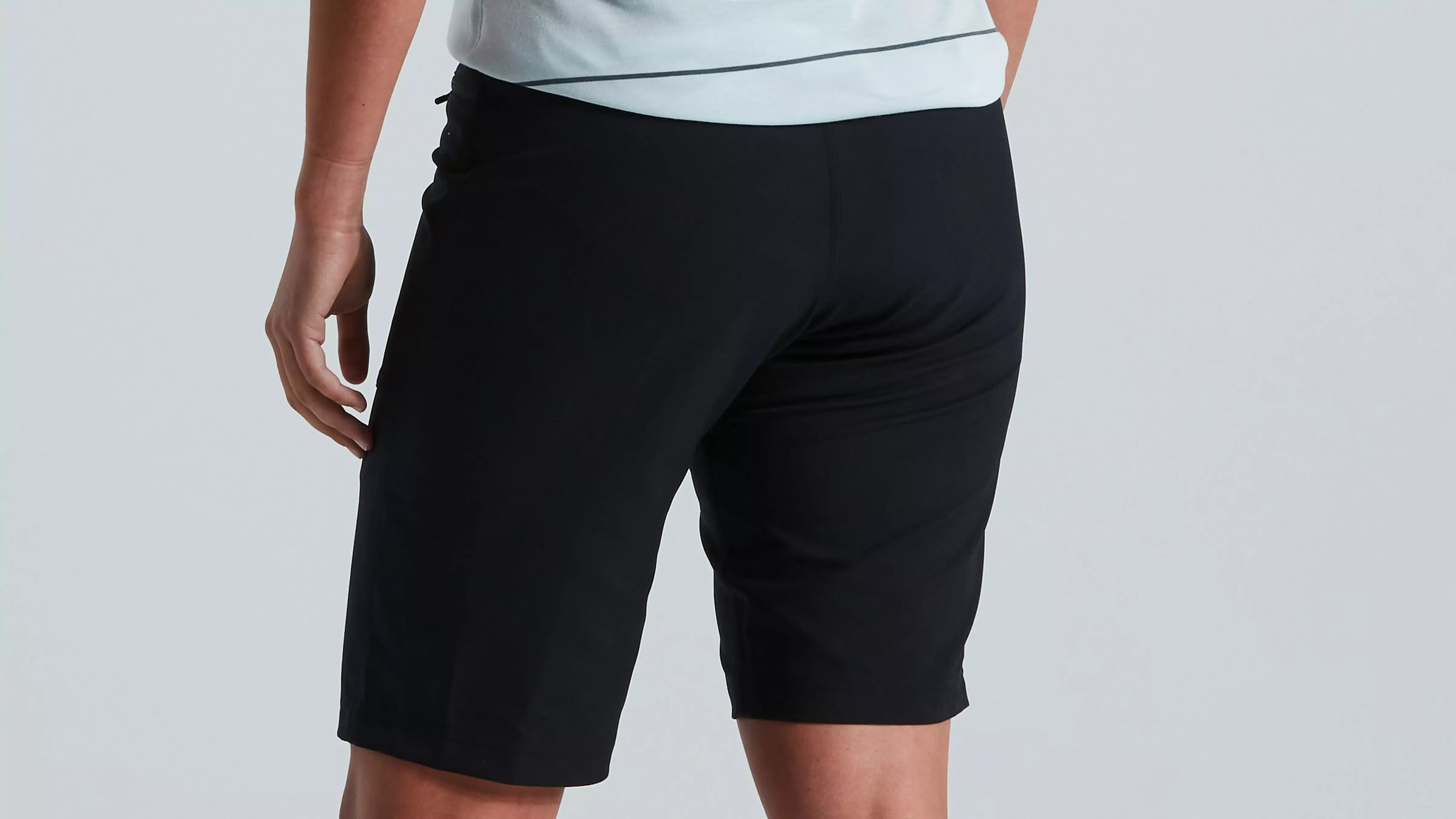 A picture of the back of a lady wearing mountain bike shorts