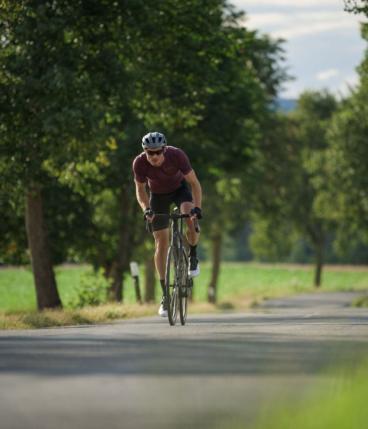 A cyclist riding a Cube Attain Race Road Bike