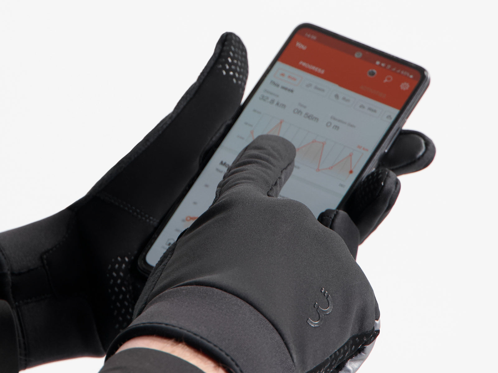A picture of the BBB BWG-36 Control Zone Winter Gloves on someone's hand while using the mobile phone
