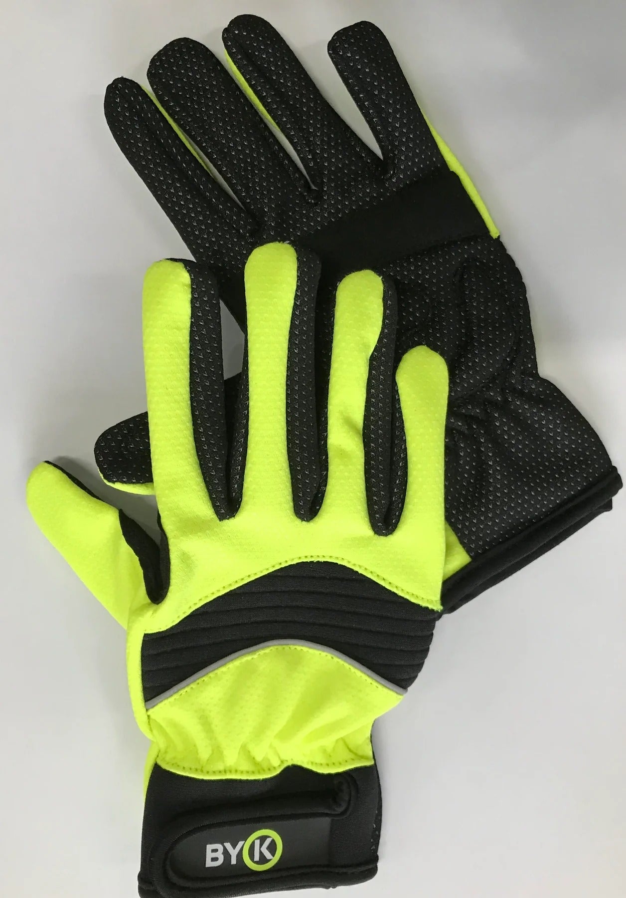 Pair of black and yellow kids cycling gloves with 'BYK' branding on a white background