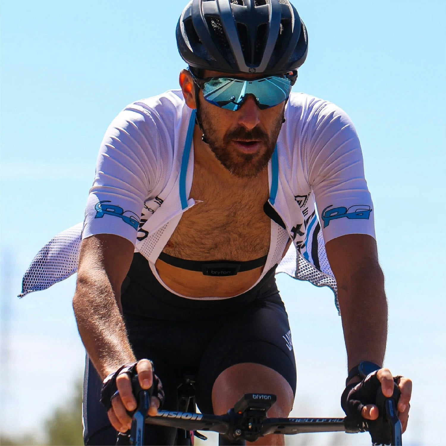 A picture of a cyclist wearing the Bryton Smart Heart Rate Monitor while riding a road bike