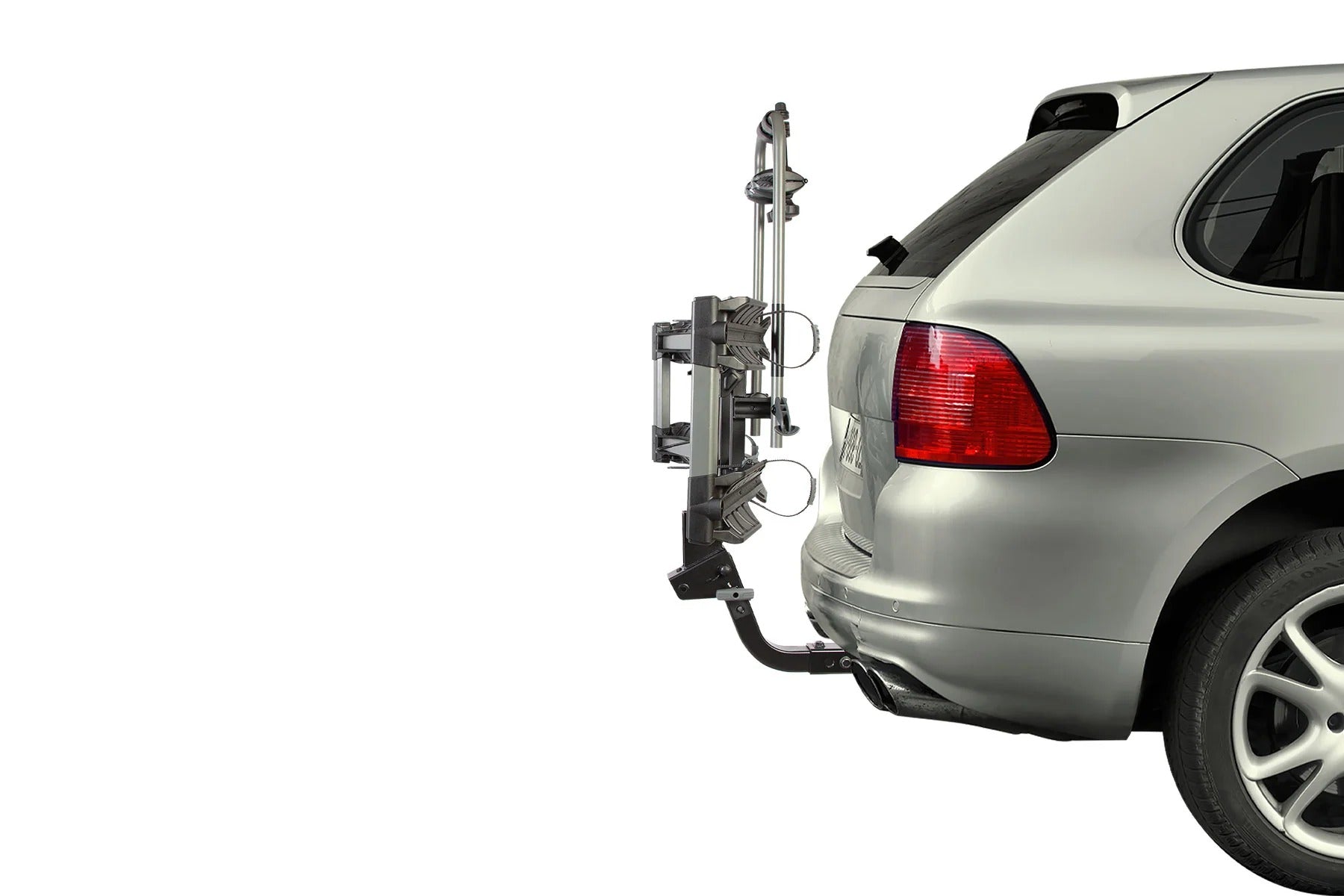 Bicycle rack attached to the back of a car and tilted up on a white background