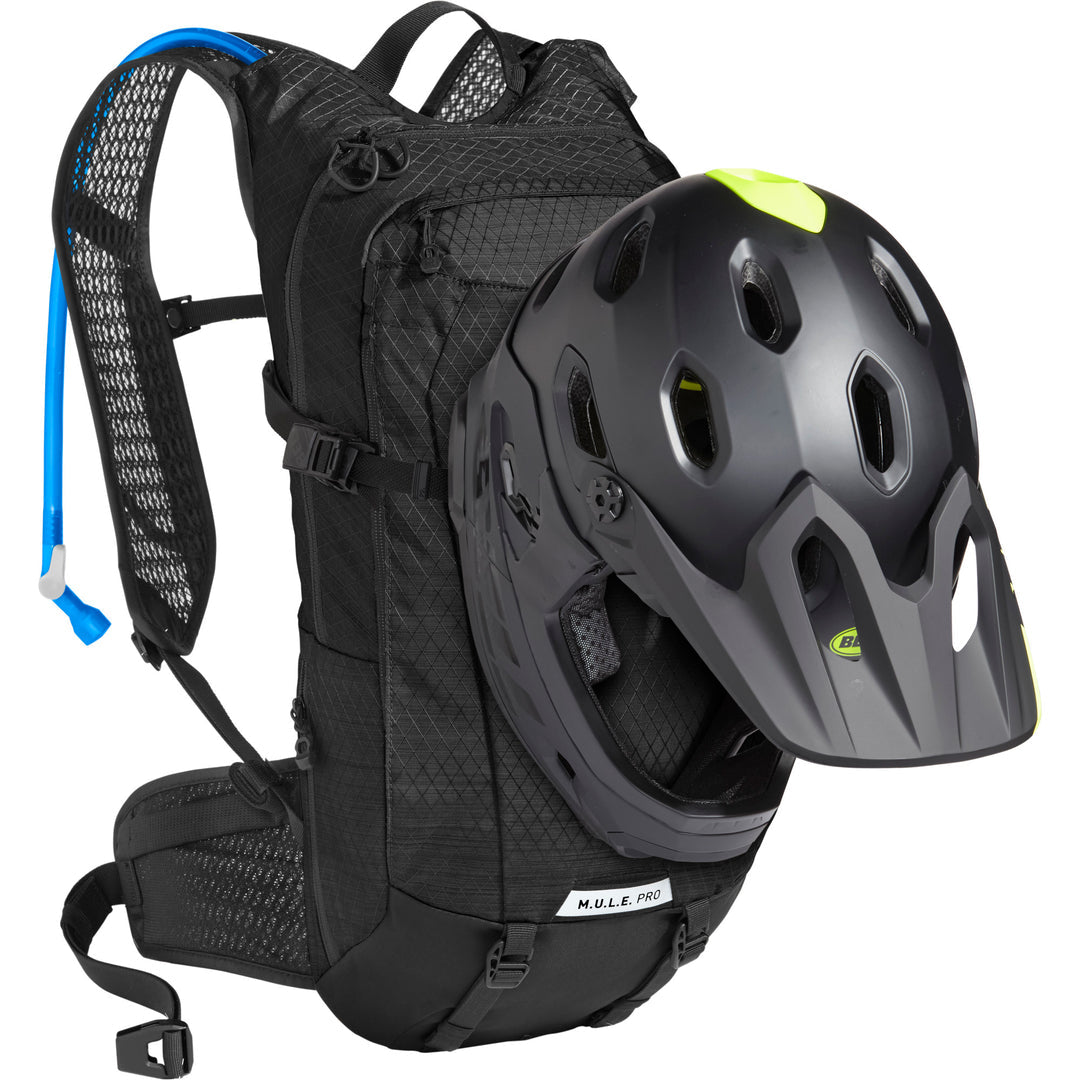 A picture of a helmet attached to the Camelbak M.U.L.E. Pro 14 3 Litre S24