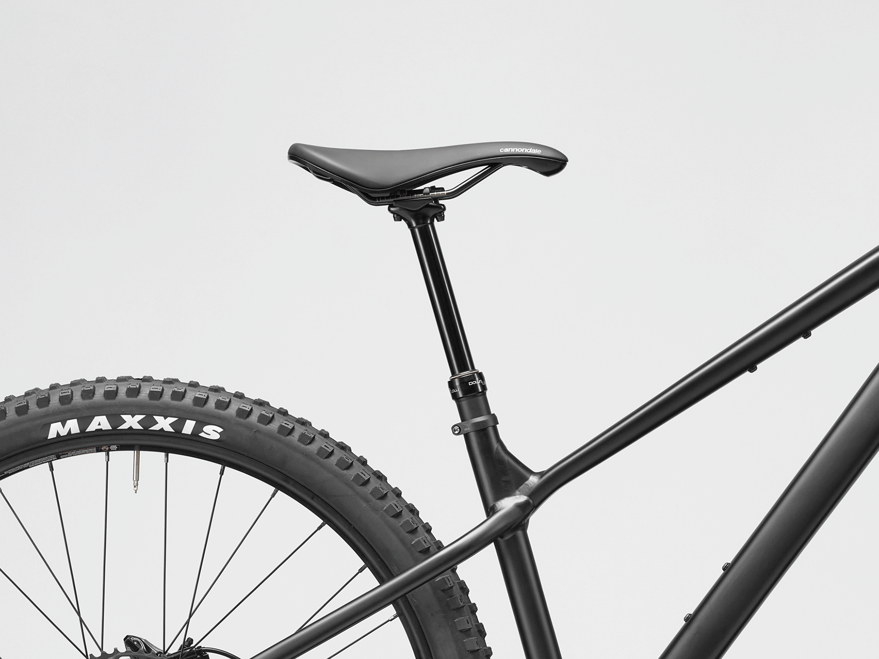 Close-up of a mountain bike saddle on a light gray background