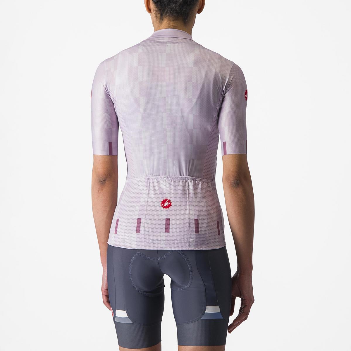 Cycling outfit with a lilac patterned jersey and dark shorts on a white background