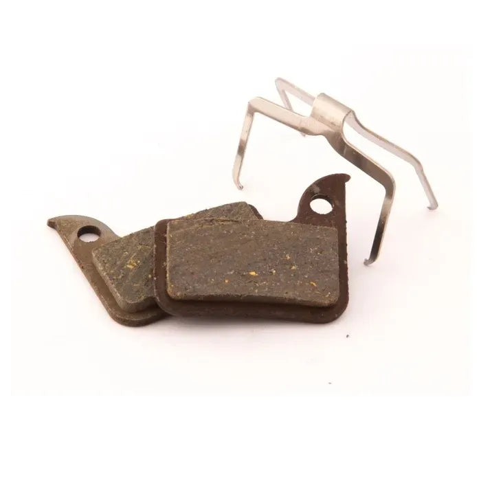 Bicycle Disc brake pads with a metal clip on a white background