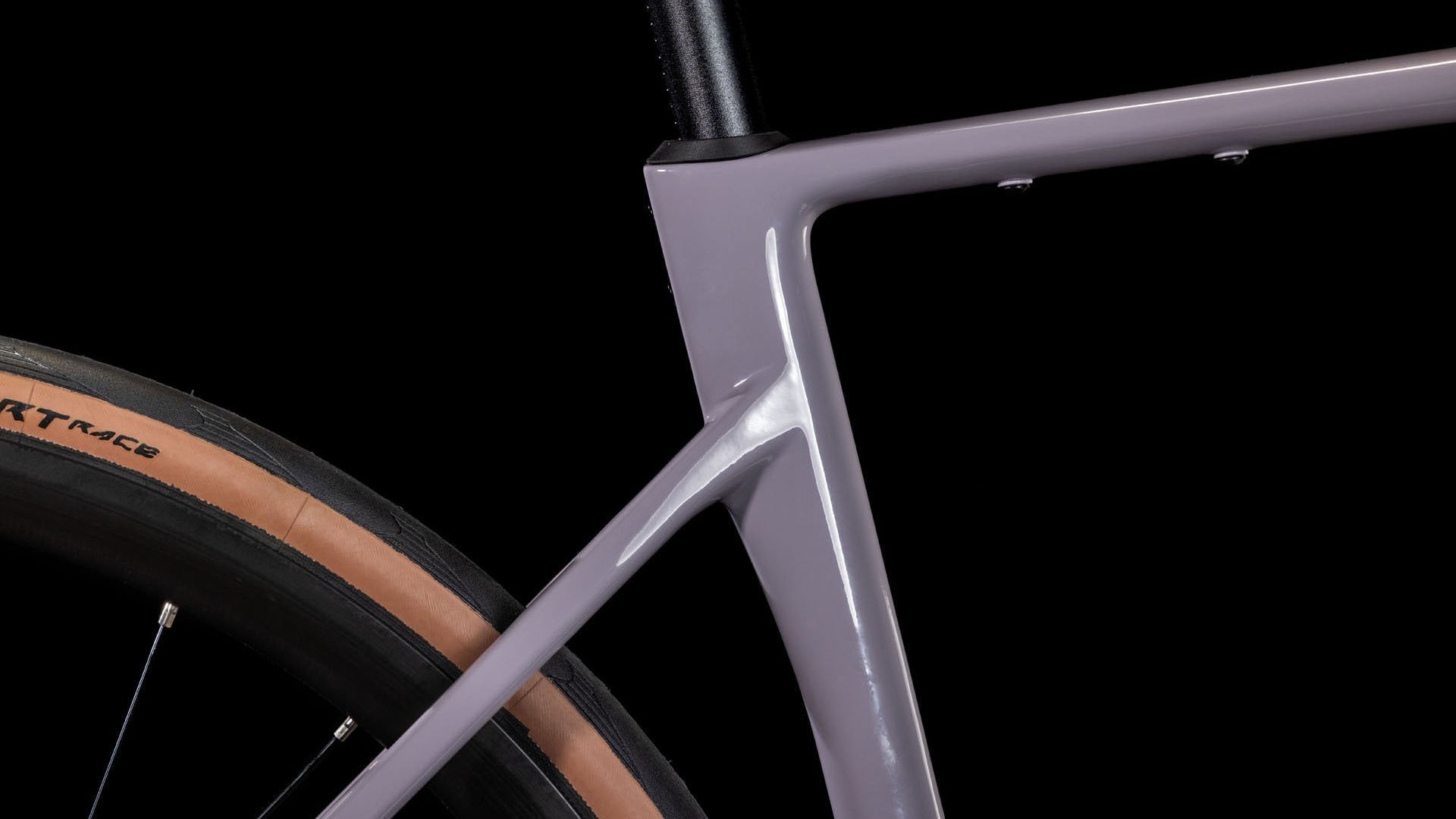 Close-up of a bicycle frame with a black background