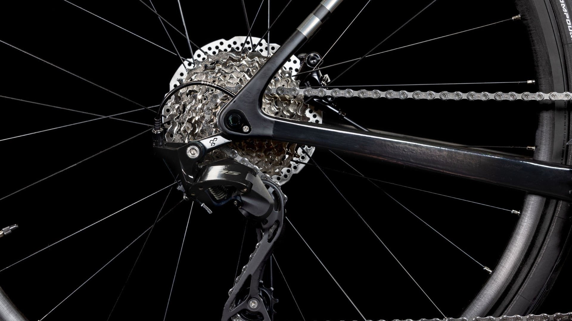 Close-up of a bicycle gear system with a black background