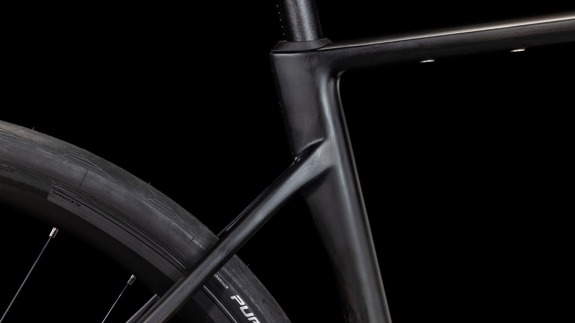 Close-up of a bicycle frame with a black background
