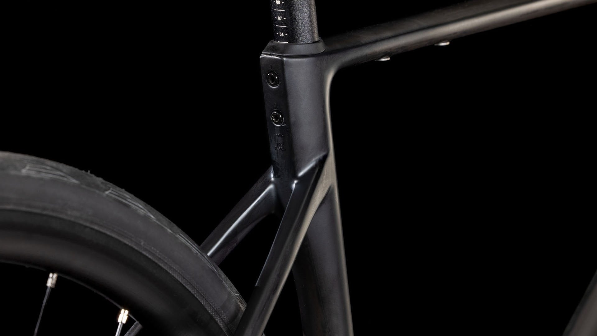 Close-up of a bicycle frame with a black background