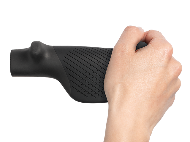 Hand holding the bar end a black bicycle grip on a white background