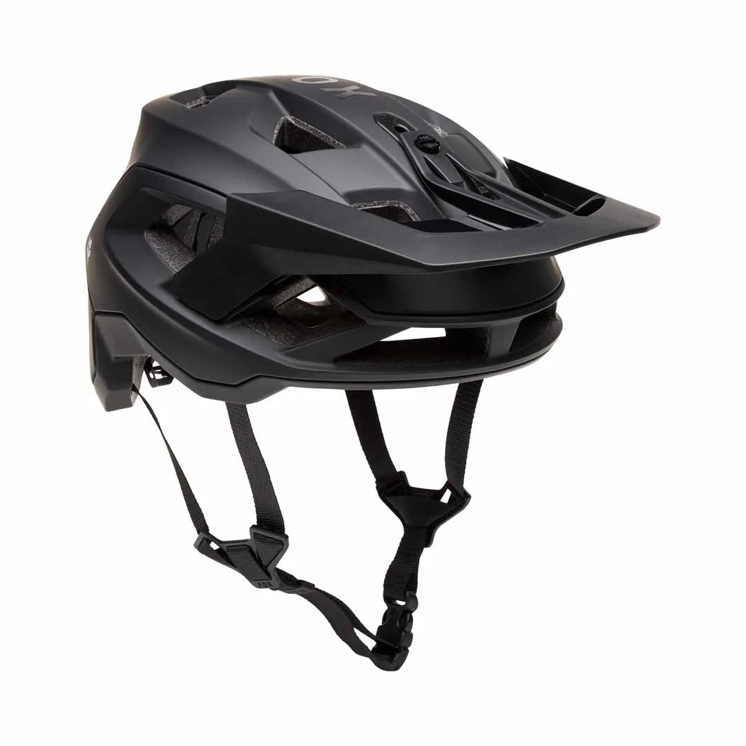Black mountain bike helmet with chin strap on a white background