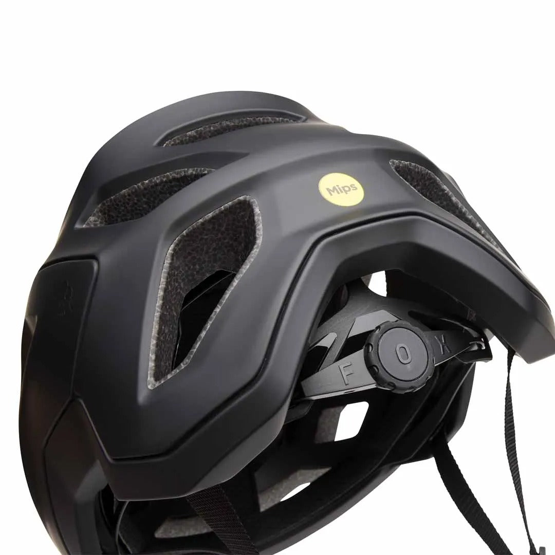 Black FOX Mountain Bike helmet with a yellow MIPS sticker on the back on a white background