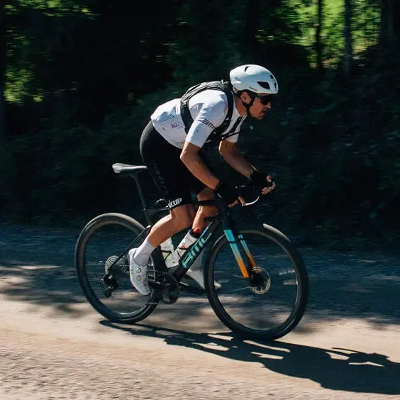 Gravel rider on his gravel bike in action on a forested path