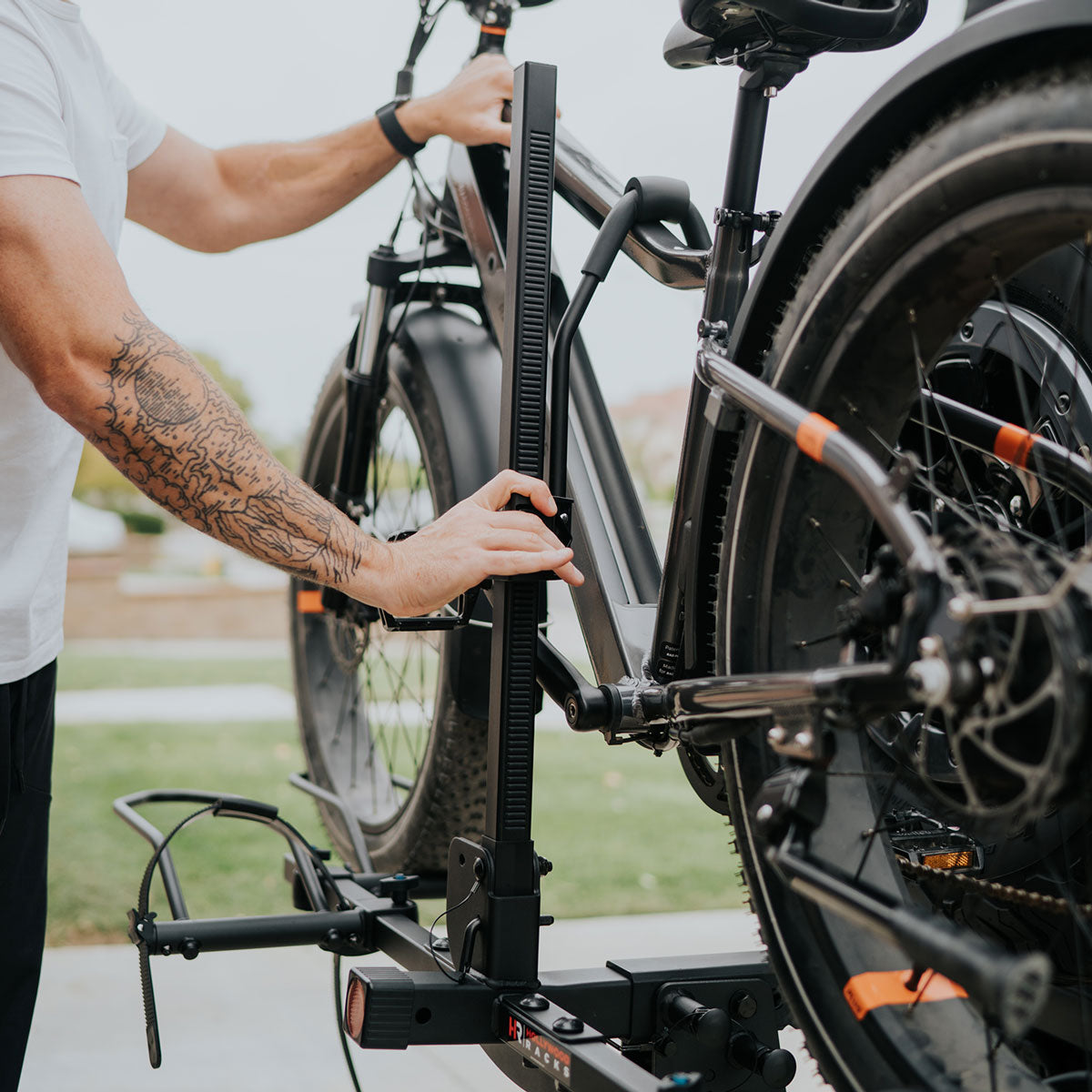 A picture of someone installing a Hollywood Bike Rack to their car