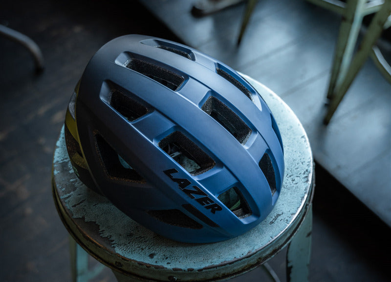 A picture of the Lazer Tonic Kineticore Blue Helmet on a stool