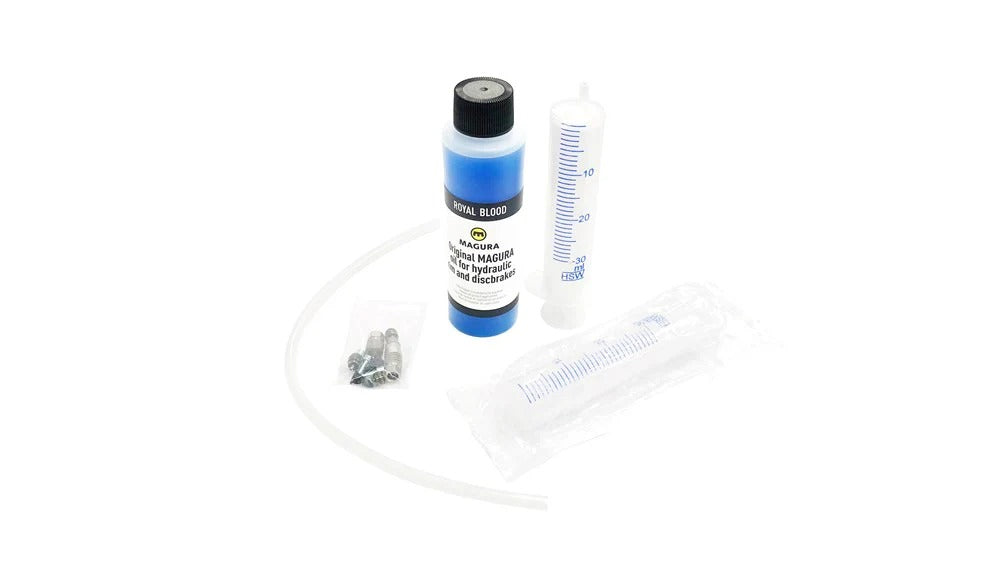 Bottle of Magura Royal Blood Hydraulic Brake Fluid with syring and fittings on a white background