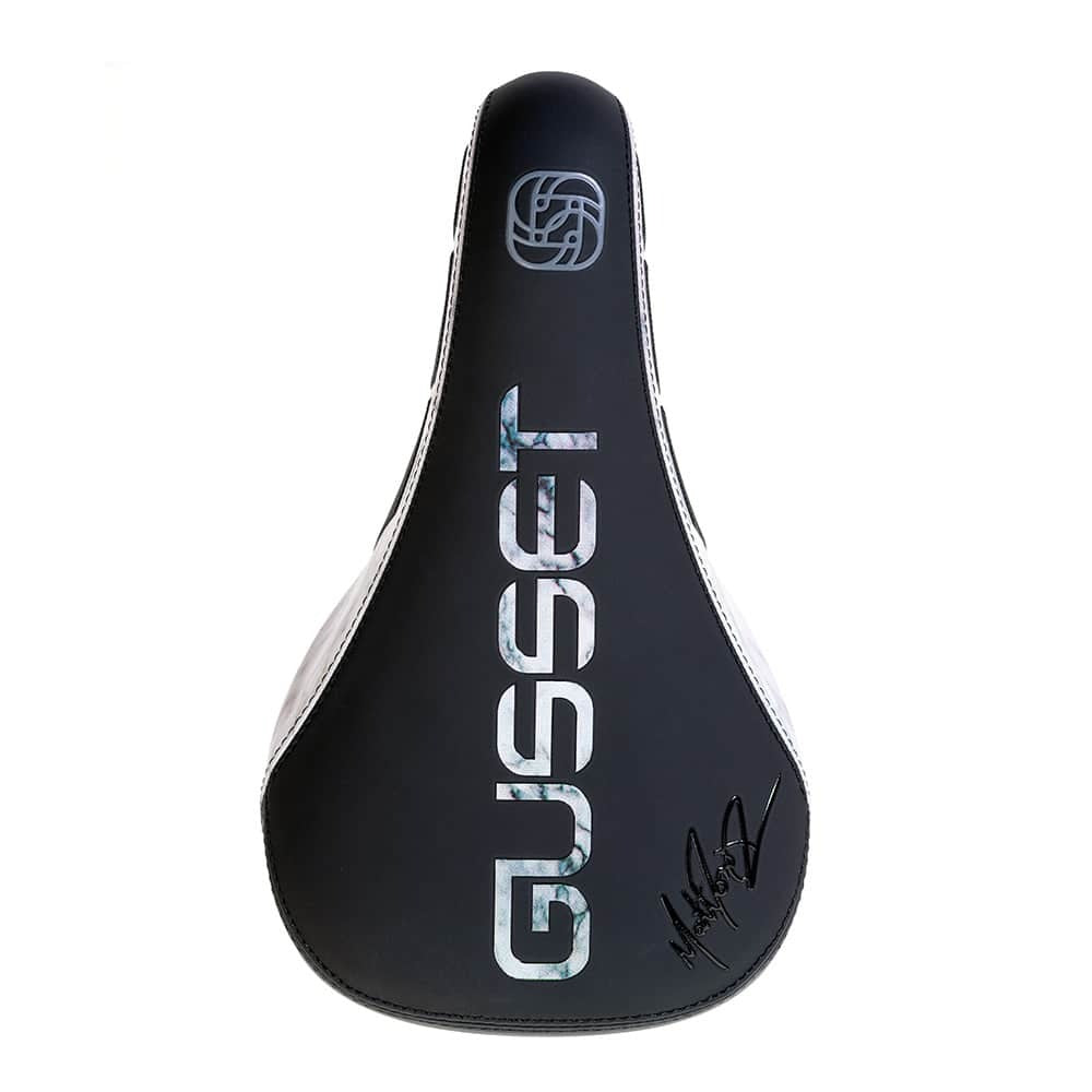 Black bicycle seat with 'Gusset' branding on a white background