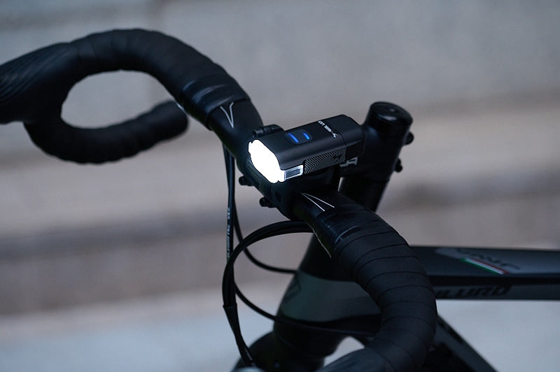 A picture of the Moon Rigel Front Lite 500 mounted on a road bike