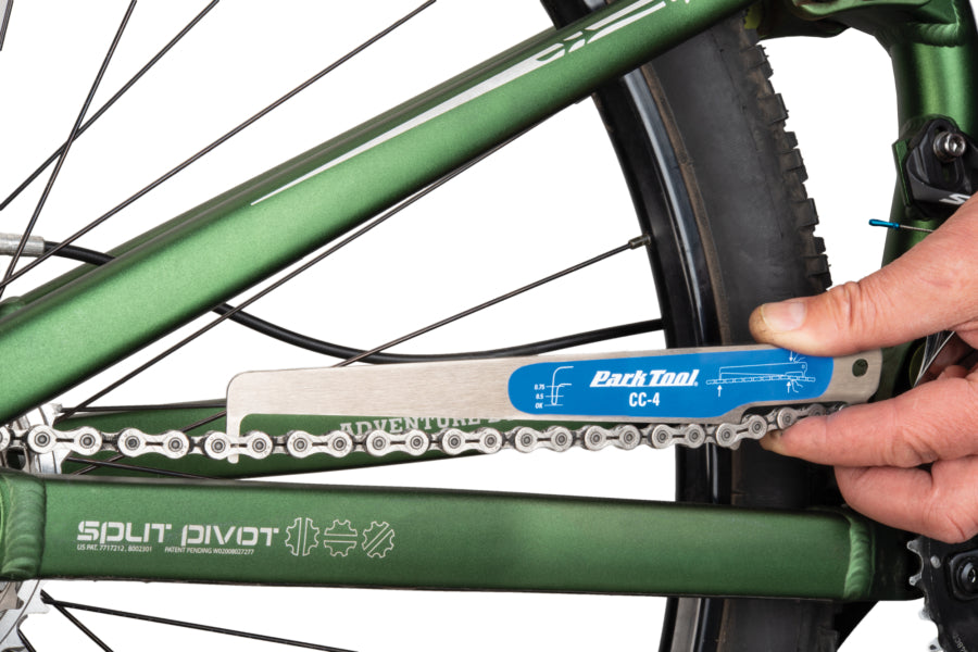 A picture of the Parktool CC-4 Chain Checker being used to measure a chain