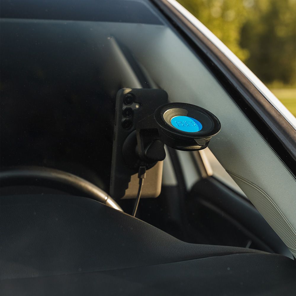 Car phone mount on the windscreen inside a vehicle
