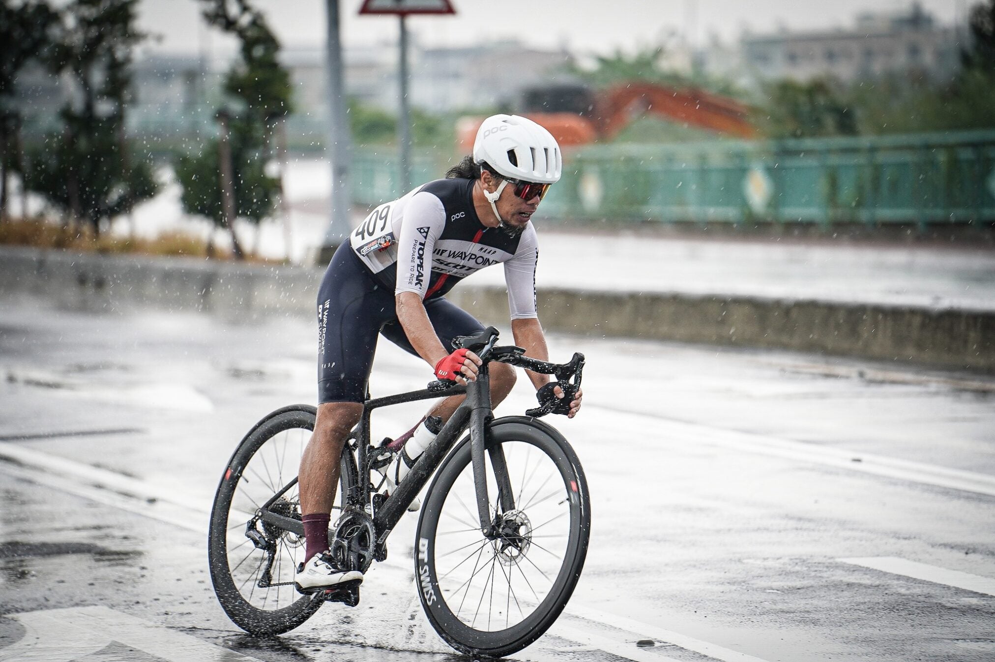 A picture of a guy riding a road bike with the Guee Bar Tape on bike