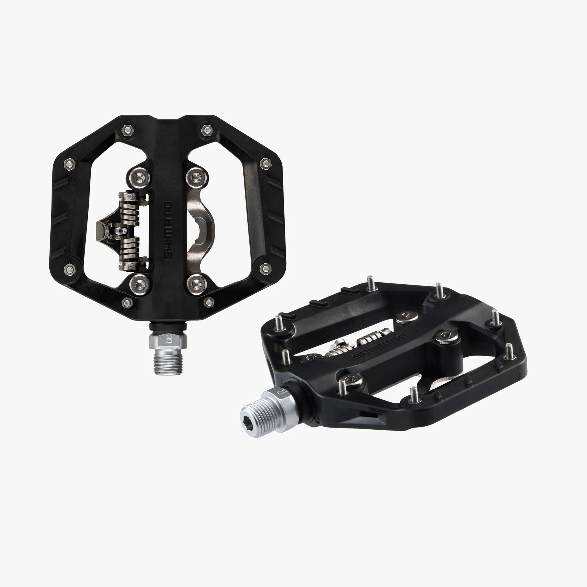 Two black bicycle pedals on a white background