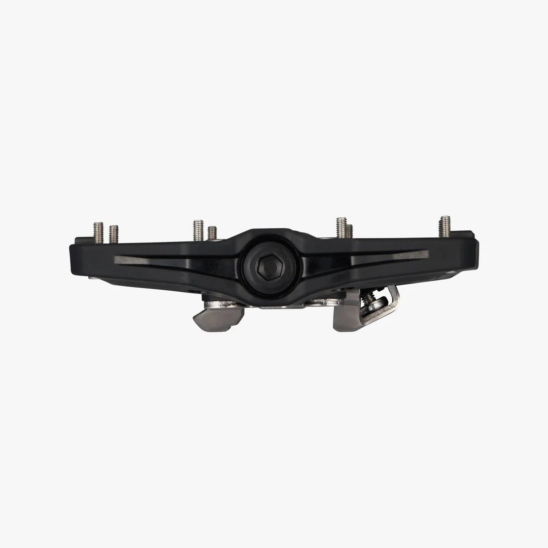 Side view of a black flat bicycle pedal on a white background