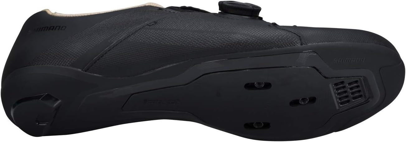Black Shimano cycling shoe showing the sole with cleat bolts on a white background