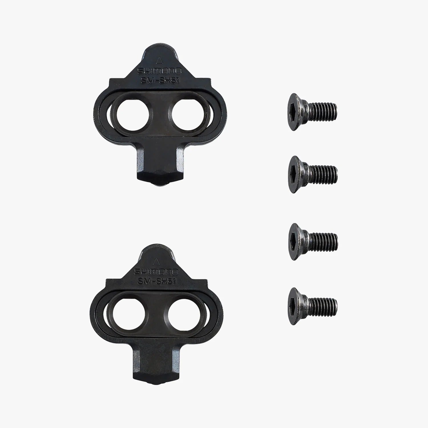 Two sets of Mountain Bike Cleats with bolts alongside on a white background