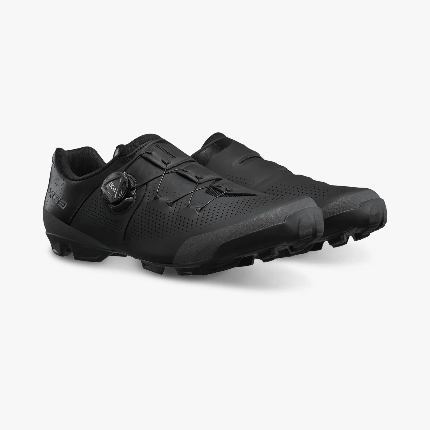 Pair of black Shimano cycling shoes on a white background