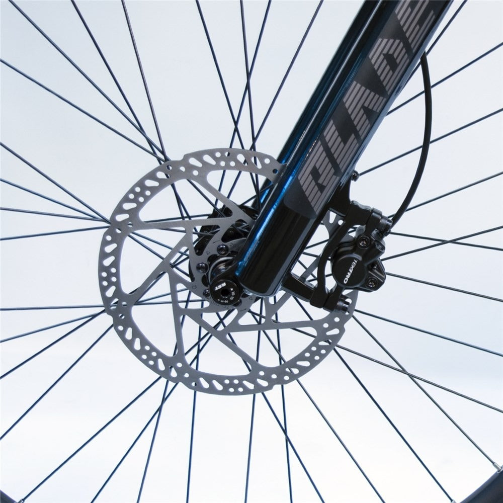 Close-up of a bicycle wheel with disc brake system on a white background