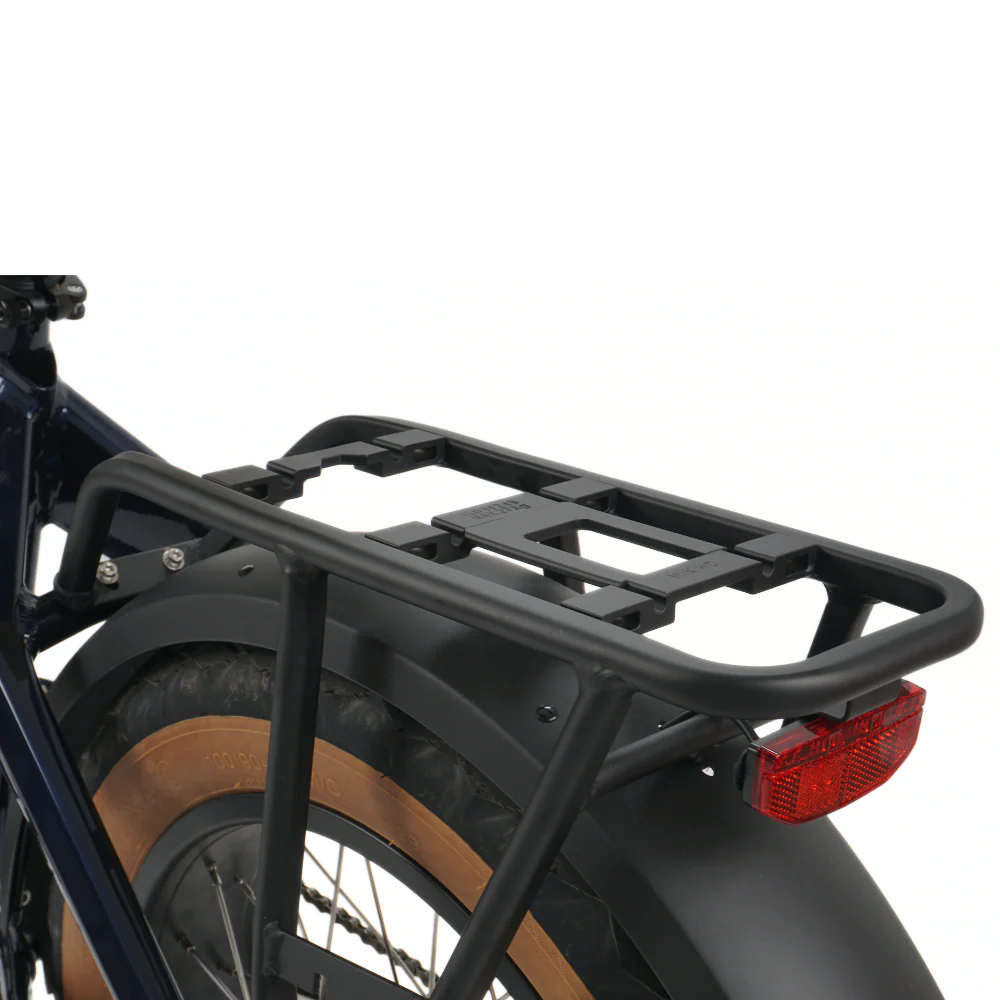 Close up of a rear pannier rack on a bicycle showing the rear light attached on a white background