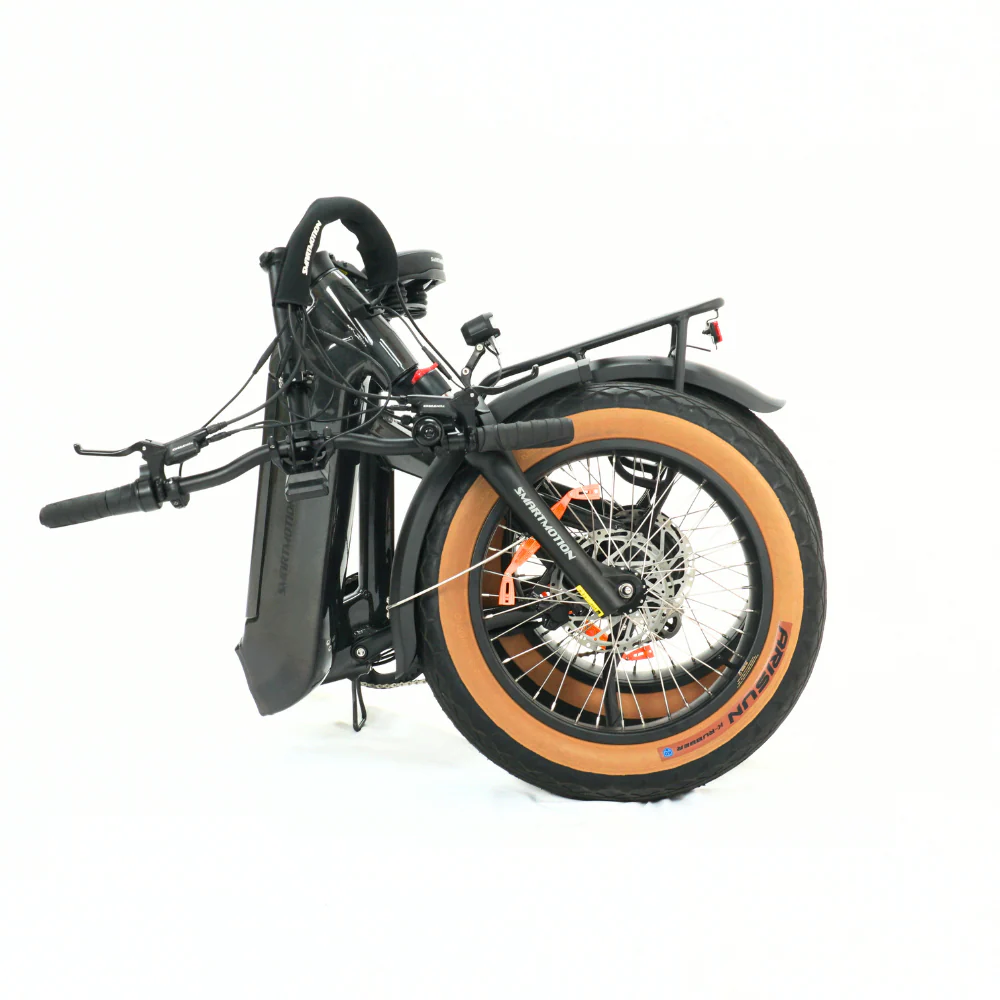 Foldable bicycle with tanwall tyres on a white background