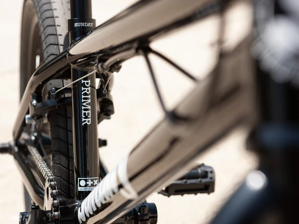 Close-up of the Sunday Primer BMX BIke Seat tubebicycle frame on a blurred background.
