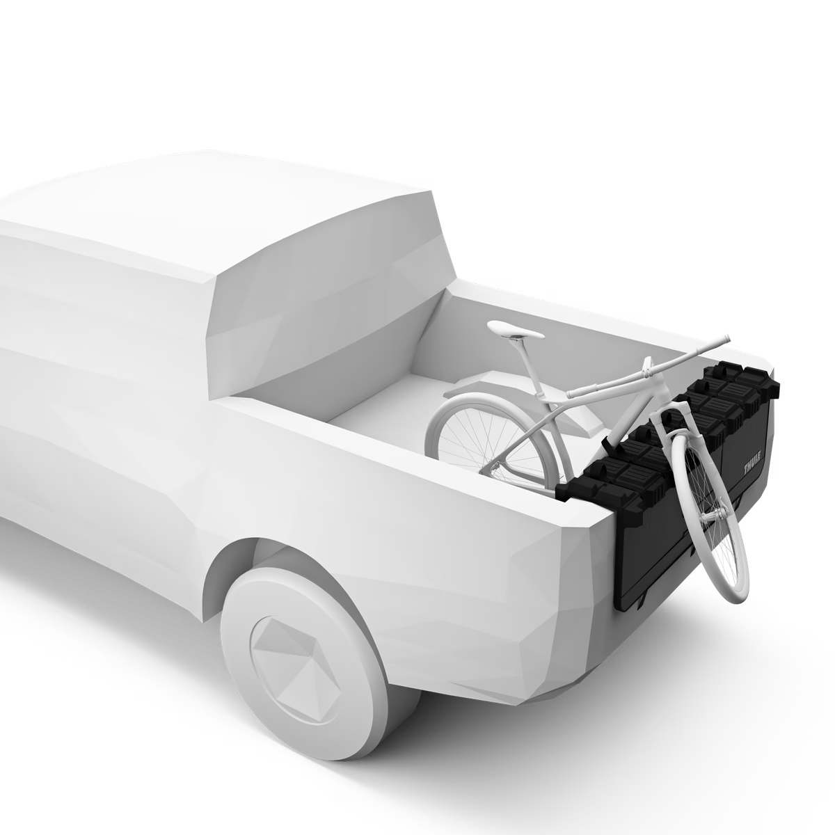 A black bicycle truck bed rack mounted on the rear of a white pickup truck, shown with a white bicycle inside the truck bed on a clean white background.