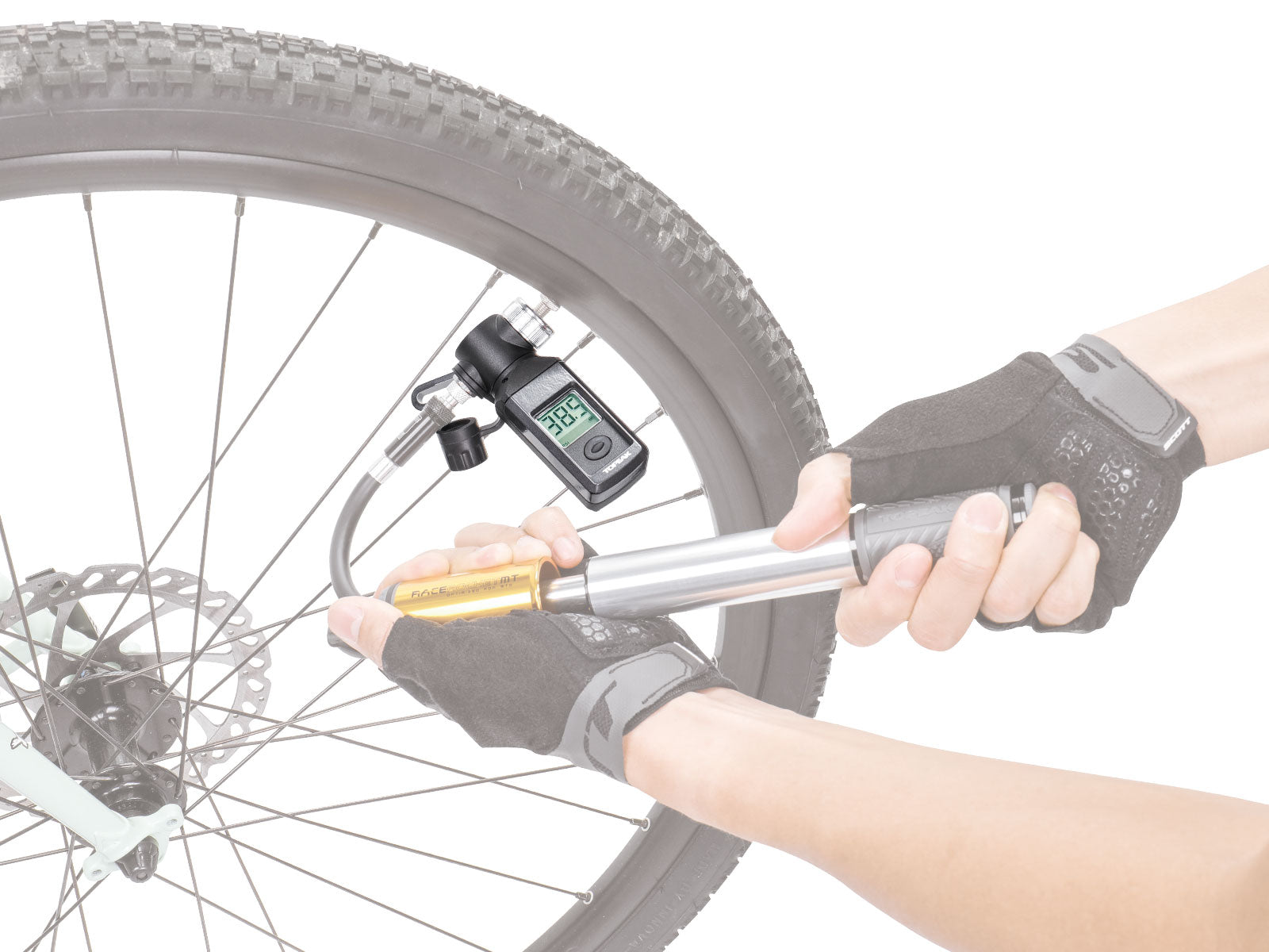 A picture of the Topeak Shuttle Gauge Digital Pressure Gauge for Presta & Schrader being used on a tyre