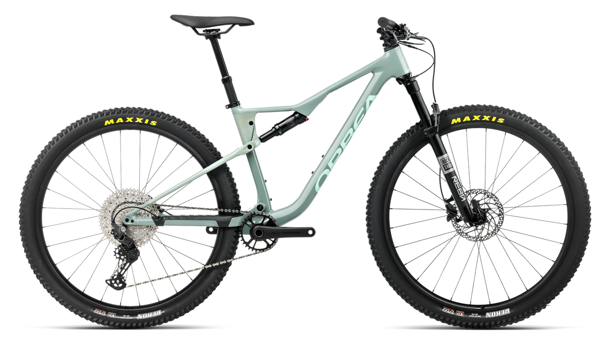 A light green Orbea dual suspension bike on a white background