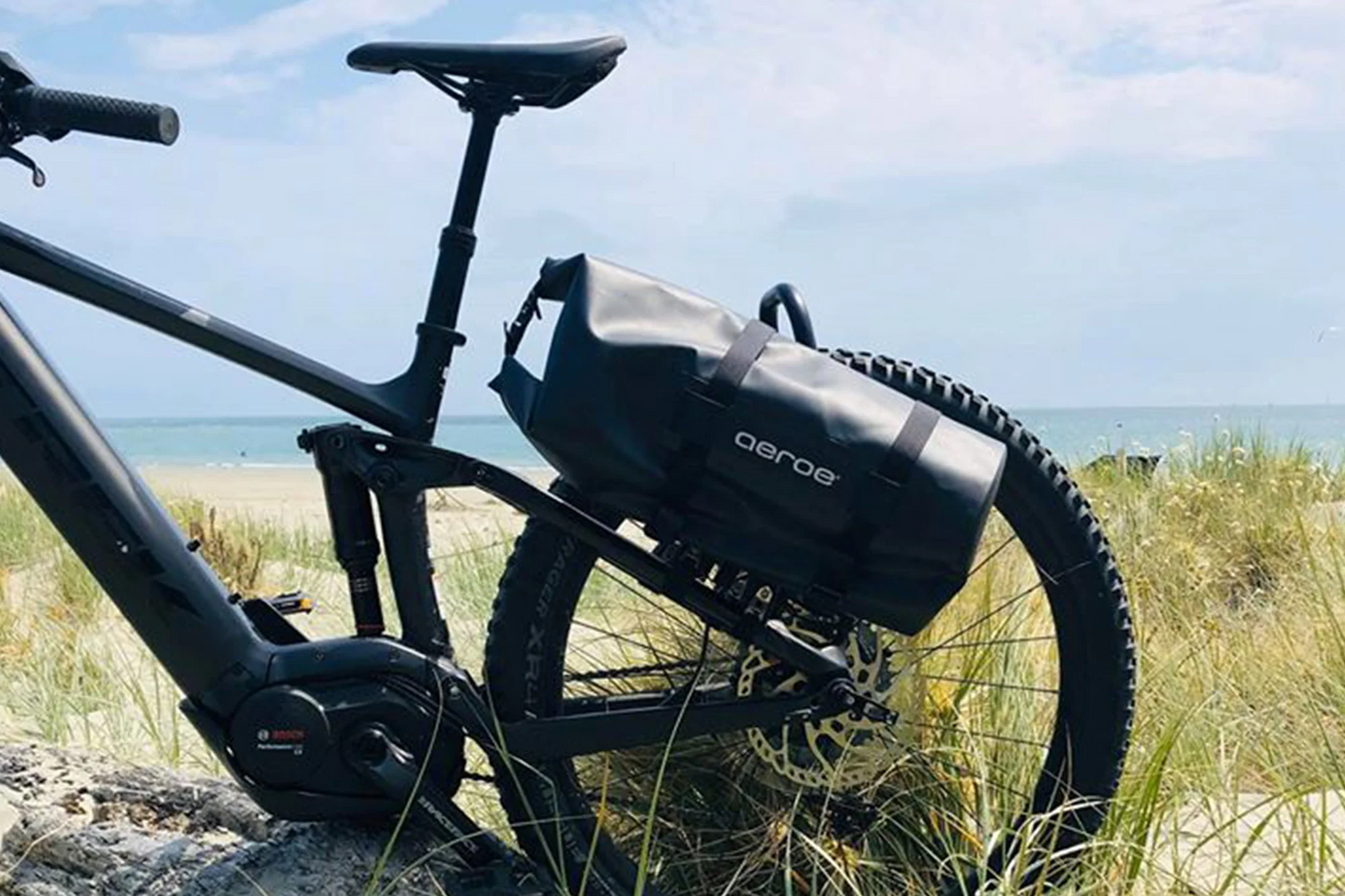 A picture of the Aeroe 12 Litre Dry Bicycle Bag attached to the back of a bike