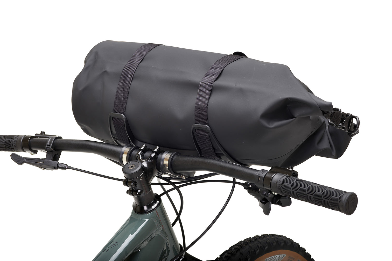 A picture of the Aeroe 12 Litre Dry Bicycle Bag attached to the handlebars of a mountain bike