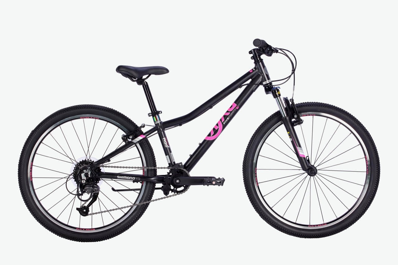 BYK black and pink kids mountain bike on a white background