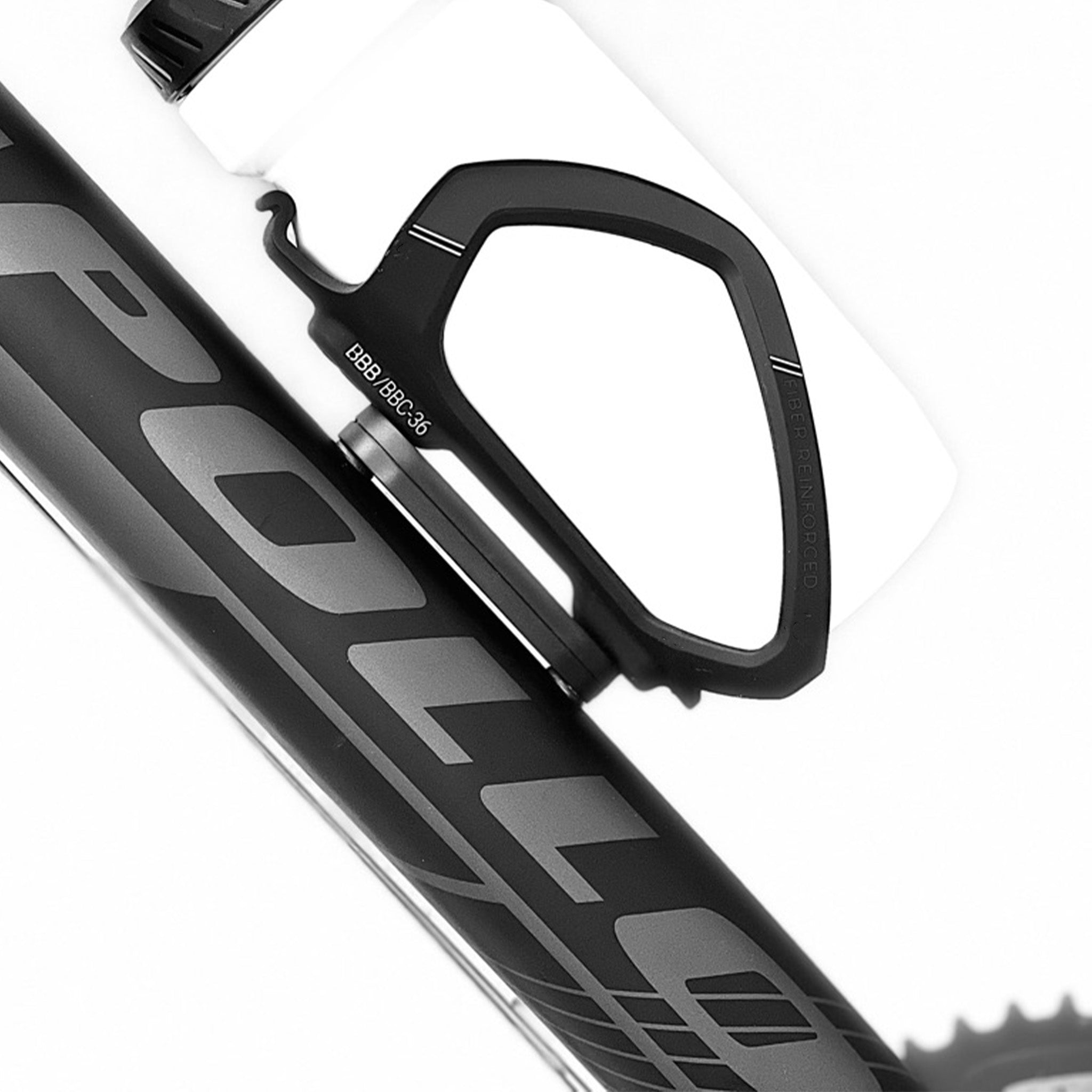 Close-up of a bottle cage mounted to a tracking device on a bicycle on a white background