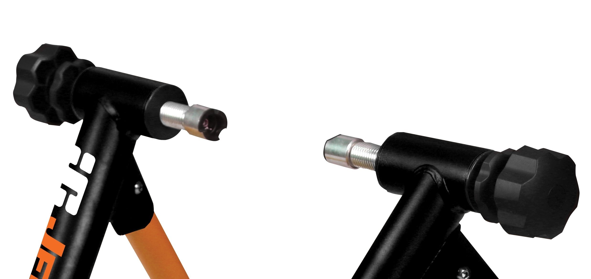 Close-up of a bike indoor trainer with black and orange accents on a white background