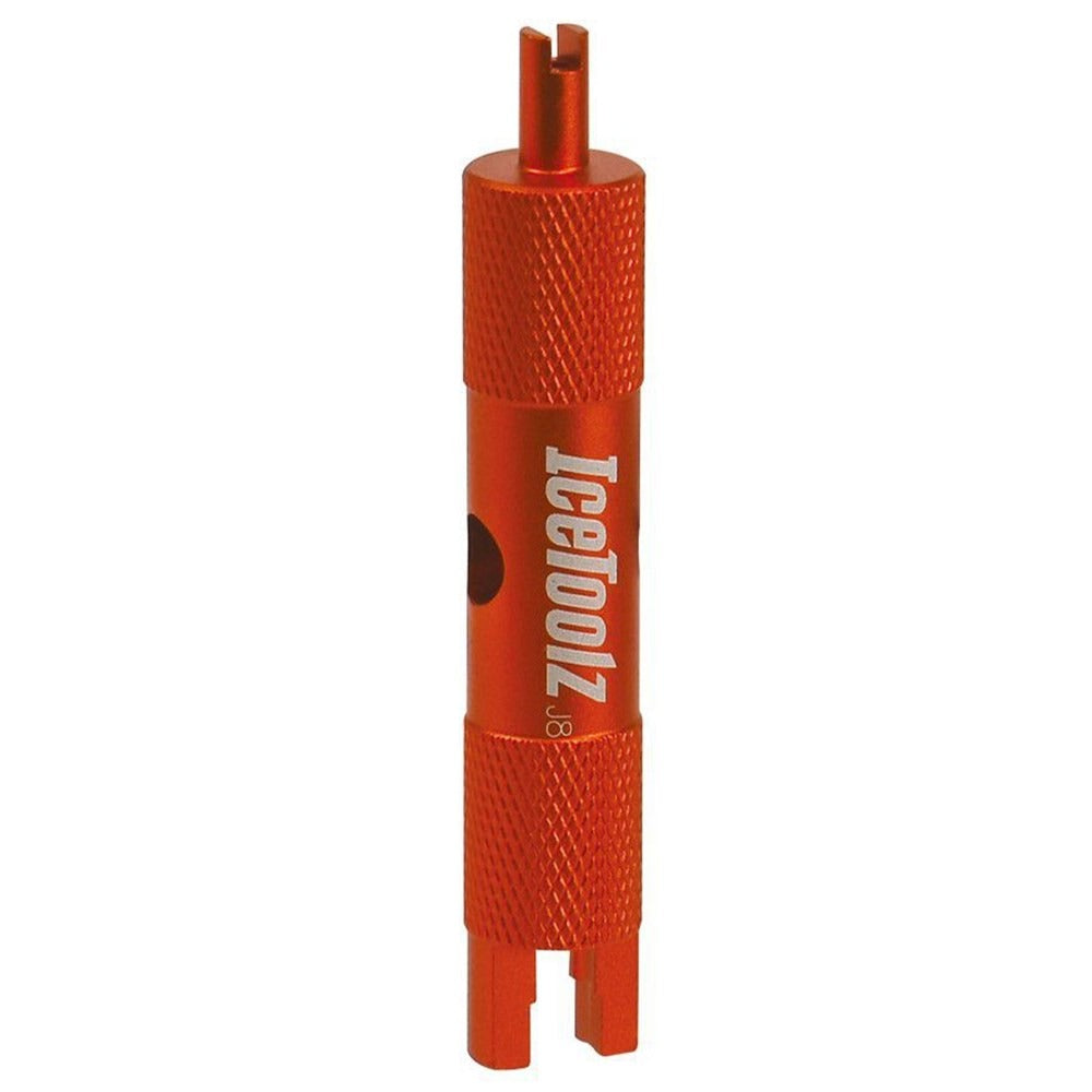 Orange valve core removal tool with 'IceToolz' branding on a white background