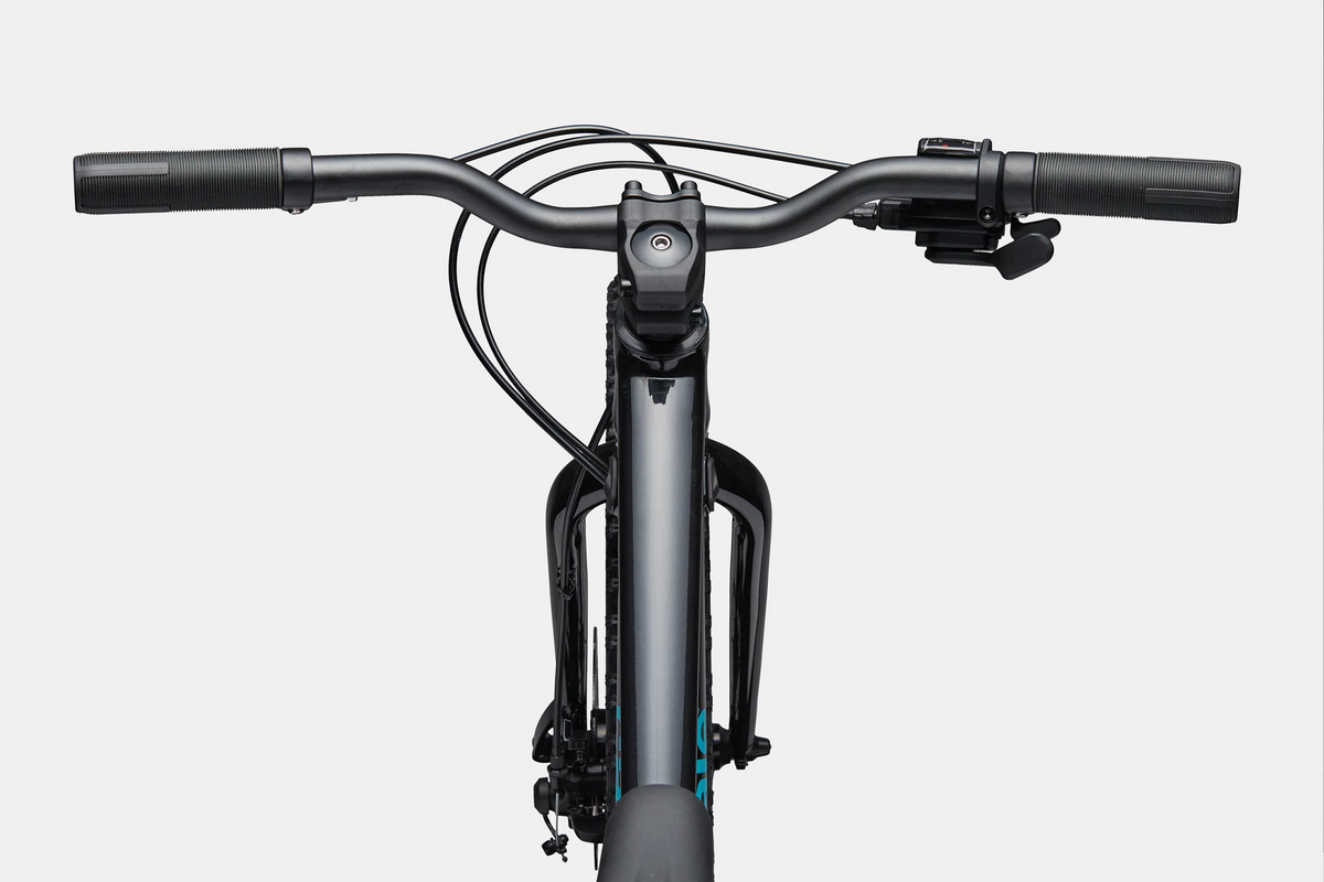 Close up of the handlebars and top tube of a black mountain bike on a white background