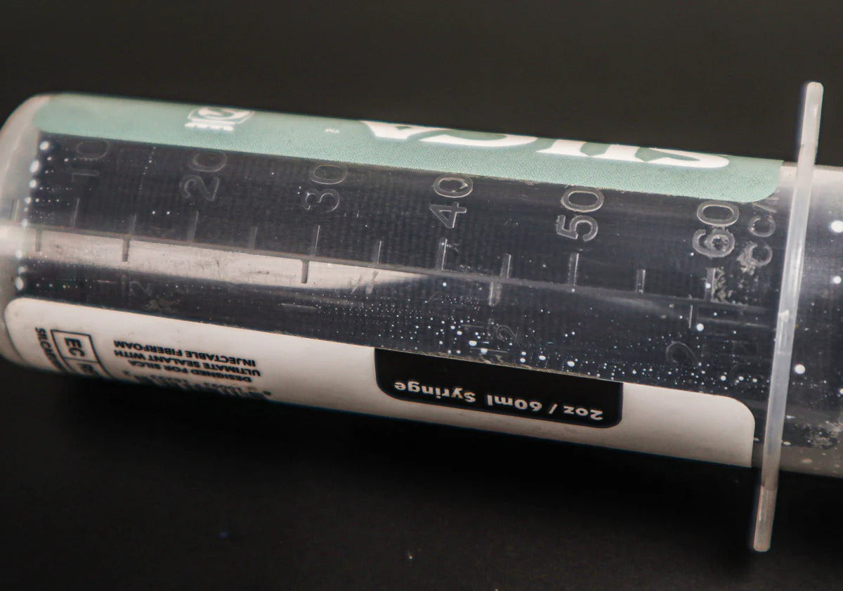 Silca Tyre Sealant Injector with measurement markings on a black background