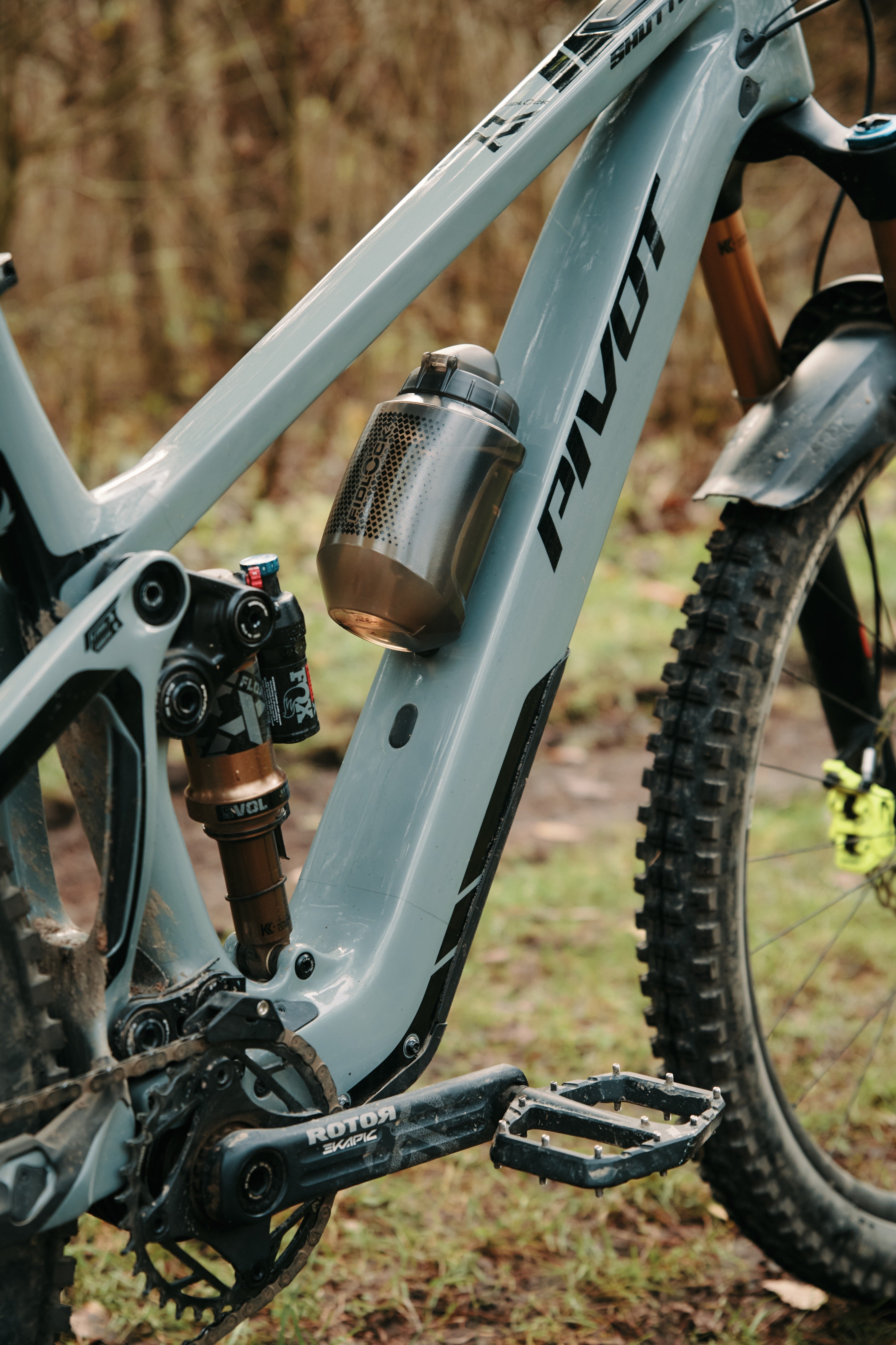 Close-up of a mountain bike with a visible brand logo in an outdoor setting.