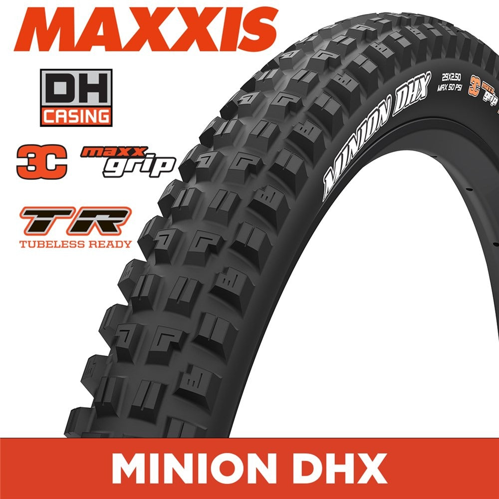 A black Maxxis Minion DHX bicycle tyre shown on a white background with several Maxxis branding and feature callouts in orange, black, and white. The tire tread is angled diagonally across the frame.