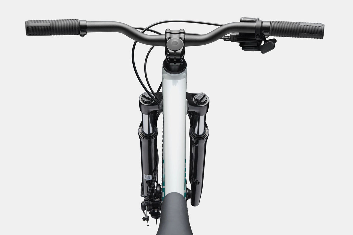 Close up of a handlebar and top tube on a white mountain bike on a white background